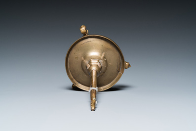 A Flemish or Dutch bronze candlestick, 14/15th C.