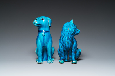 A Chinese turquoise-glazed cat and a dog on wooden stands, 19th C.