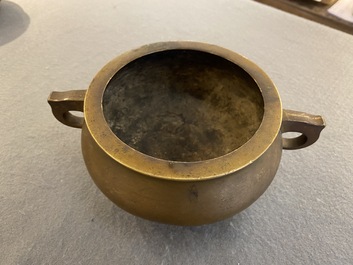 A Chinese bronze tripod censer, Xuande mark, 18th C.