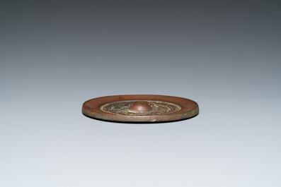 A Chinese bronze mirror, Ming