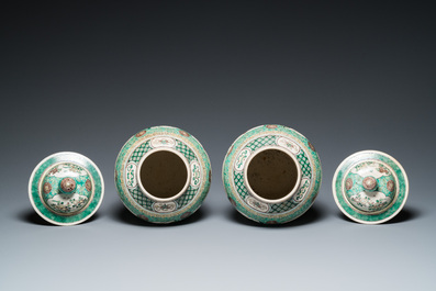 A pair of Chinese verte biscuit vases and covers, 19th C.