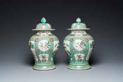 A pair of Chinese verte biscuit vases and covers, 19th C.