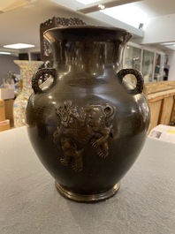 An extremely rare Chinese inlaid relief-modelled bronze 'hu' vase, Xuande mark, late Ming