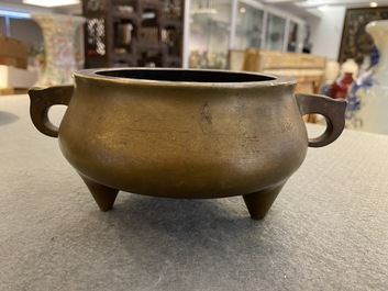 A Chinese bronze tripod censer, Xuande mark, 18th C.