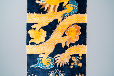 A Chinese silk 'dragons' carpet, 19th C.
