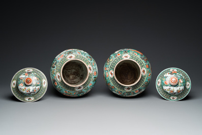 A pair of  Chinese famille verte vases and covers, 19th C.
