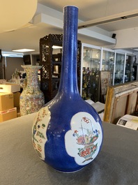 A Chinese famille verte powder-blue-ground bottle vase, Kangxi