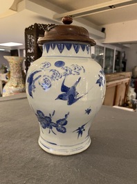 A Chinese blue and white vase with birds among blossoming branches, Transitional period