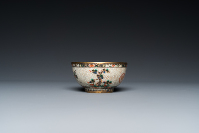 An unusual Chinese famille verte crackle-ground cup and saucer with gilt brass mounts, Kangxi