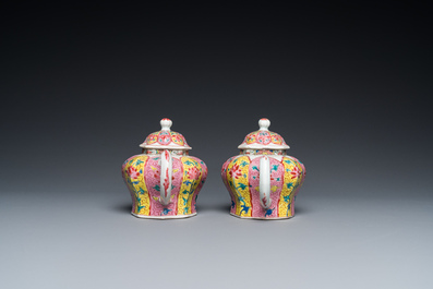 A pair of Chinese octagonal famille rose teapots on stands, Yongzheng