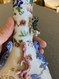 A Chinese famille rose '18 Luohans' bottle vase, 19th C.