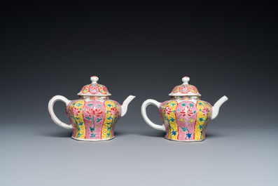 A pair of Chinese octagonal famille rose teapots on stands, Yongzheng