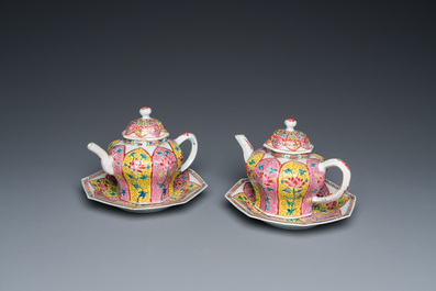 A pair of Chinese octagonal famille rose teapots on stands, Yongzheng