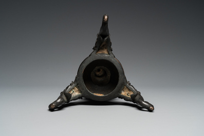 A large Chinese bronze reticulated candle holder, 17th C.