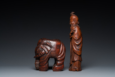 A Chinese carved bamboo statue of an elephant and one of Shou Lao, 19/20th C.
