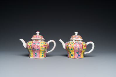 A pair of Chinese octagonal famille rose teapots on stands, Yongzheng