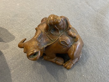 A Chinese bronze 'boy on buffalo' water dropper, Qing