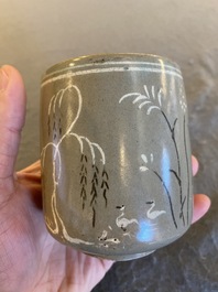 A Korean slip-decorated celadon-ground tea cup