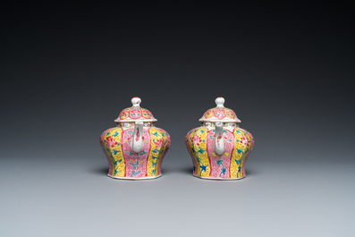 A pair of Chinese octagonal famille rose teapots on stands, Yongzheng