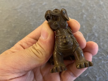 A Chinese bronze 'Buddhist lion' scroll weight, Qing