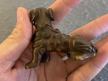 A Chinese bronze 'Buddhist lion' scroll weight, Qing