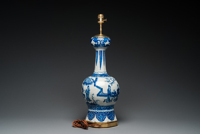 A large Dutch Delft blue and white chinoiserie vase mounted as a lamp, 1st quarter 18th C.