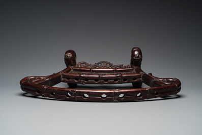 A Vietnamese wooden weapon rack with decorative weaponry, 19/20th C.