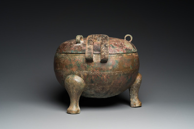 A very large archaic bronze tripod vessel and cover, 'ding', Eastern Zhou period