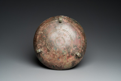 A very large archaic bronze tripod vessel and cover, 'ding', Eastern Zhou period