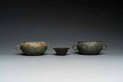 Three Chinese elliptical bronze cups, Eastern Zhou and Han