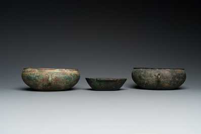 Three Chinese elliptical bronze cups, Eastern Zhou and Han