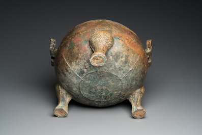 A very large archaic bronze tripod vessel and cover, 'ding', Eastern Zhou period