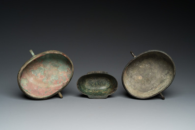 Three Chinese elliptical bronze cups, Eastern Zhou and Han