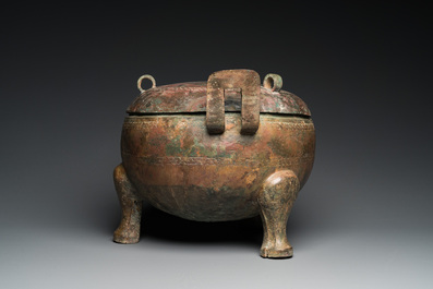 A very large archaic bronze tripod vessel and cover, 'ding', Eastern Zhou period