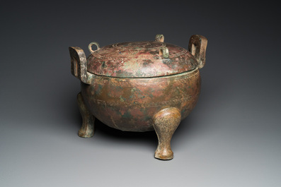 A very large archaic bronze tripod vessel and cover, 'ding', Eastern Zhou period