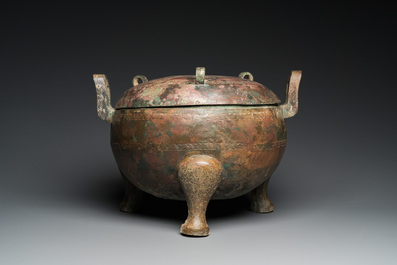 A very large archaic bronze tripod vessel and cover, 'ding', Eastern Zhou period