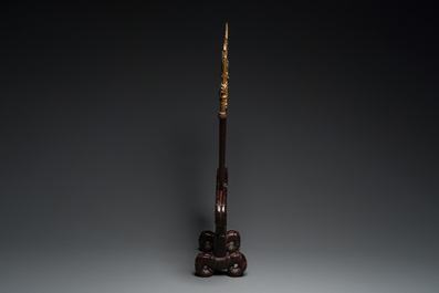 A Vietnamese wooden weapon rack with decorative weaponry, 19/20th C.