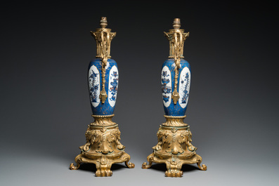 A pair of Chinese powder-blue vases with gilt bronze lamp mounts, Kangxi and 19th C.