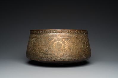 A large Islamic engraved bronze basin with calligraphic design, probably Egypt, 18/19th C.