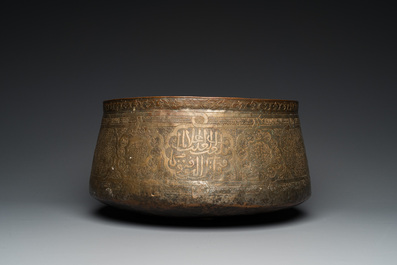 A large Islamic engraved bronze basin with calligraphic design, probably Egypt, 18/19th C.