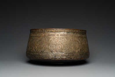 A large Islamic engraved bronze basin with calligraphic design, probably Egypt, 18/19th C.