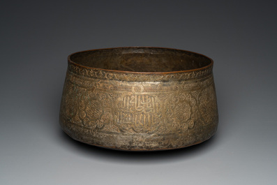 A large Islamic engraved bronze basin with calligraphic design, probably Egypt, 18/19th C.