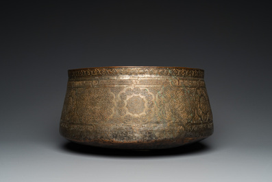 A large Islamic engraved bronze basin with calligraphic design, probably Egypt, 18/19th C.
