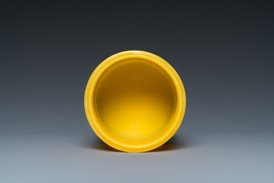 A Chinese yellow Peking glass chamfered dish and a cylindrical container, Qing/Republic