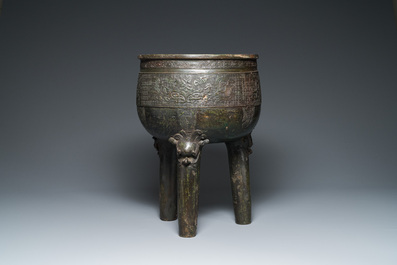 A large Chinese tripod censer on wooden base and display stand, Qing