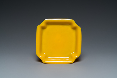 A Chinese yellow Peking glass chamfered dish and a cylindrical container, Qing/Republic