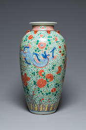 A very large Chinese famille verte 'dragon' vase on wooden stand, 19th C.