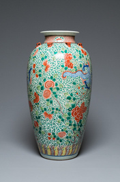 A very large Chinese famille verte 'dragon' vase on wooden stand, 19th C.