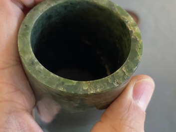 A Chinese jade brush pot, a bangle and two carvings, 19/20th C.