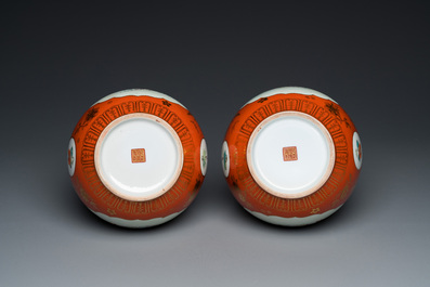 A pair of Chinese coral-ground famille rose double gourd vases, Qianlong mark, Republic